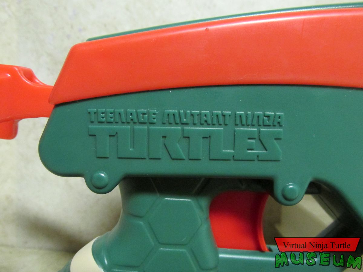 Double-Barrel Raphael TMNT logo close up